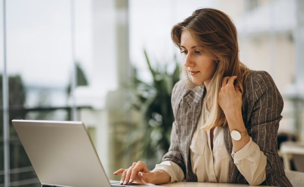 Portrait of a business woman working on laptop