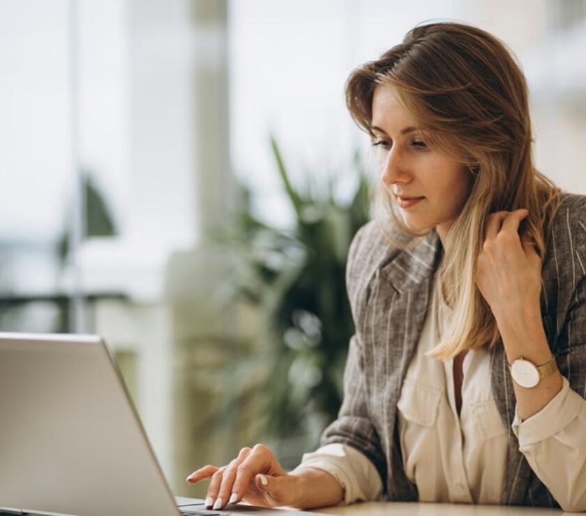 Portrait of a business woman working on laptop