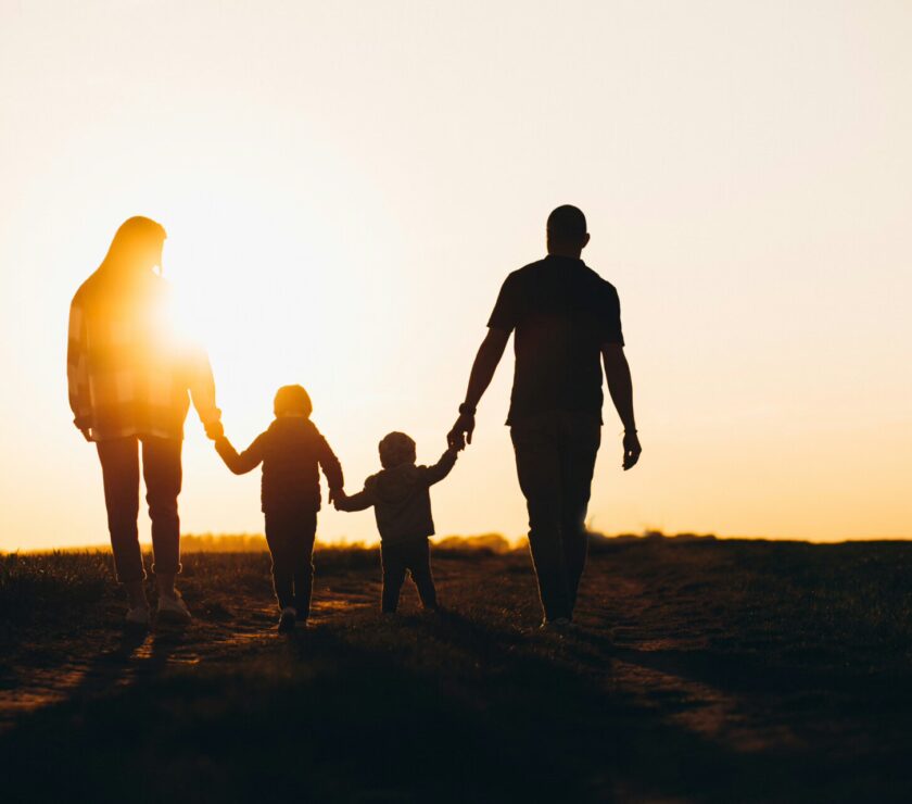 Happy family silhouette on the sunset